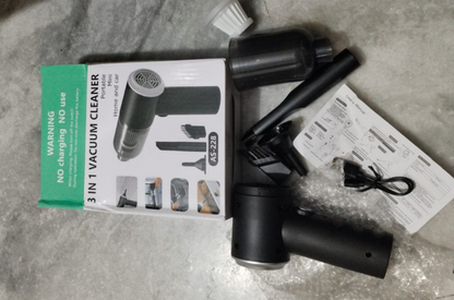 3-in-1 vacuum cleaner with packaging and accessories on a concrete floor.